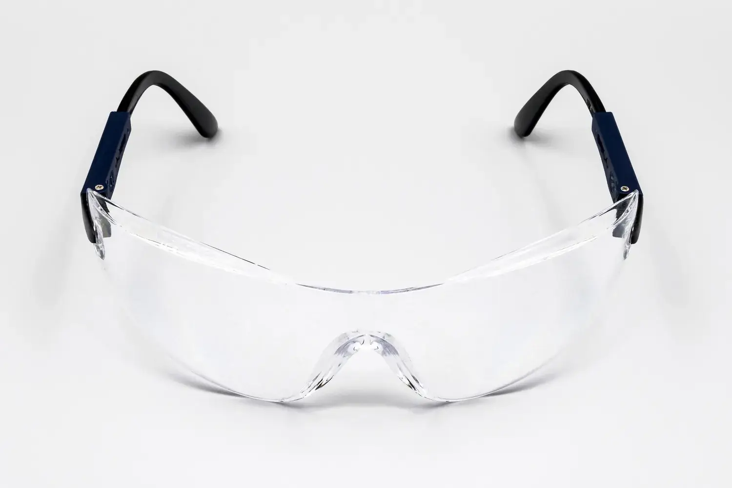 Clear wraparound safety glasses on a white background