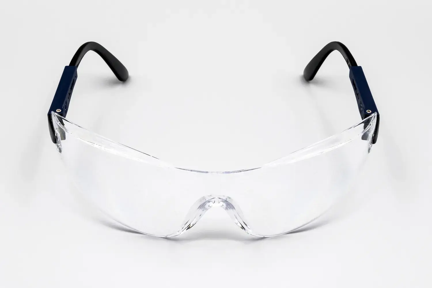 Clear wraparound safety glasses on a white background